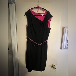 Black asymmetrical top dress with pink lining with Rosette detail